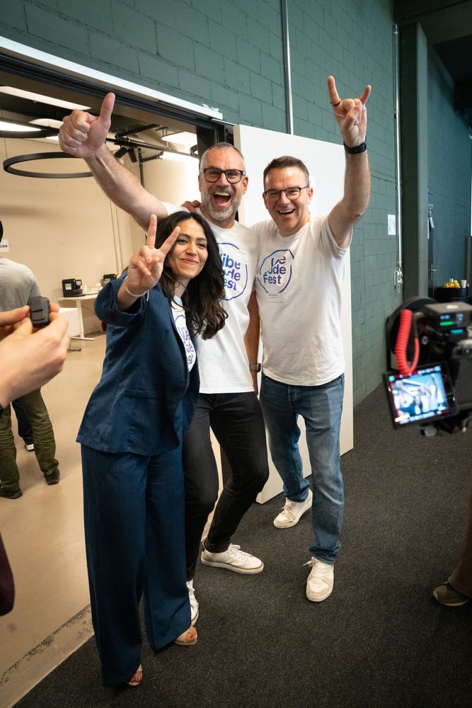Organizers celebrating with raised hands